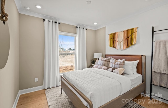 bedroom with baseboards, wood finished floors, recessed lighting, and ornamental molding