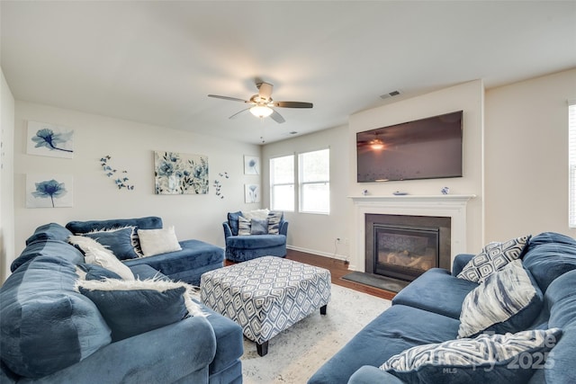 1553 Arcadia Bluff Dr, York, SC 29745 - living area with ceiling fan, a glass covered fireplace, baseboards, and wood finished floors