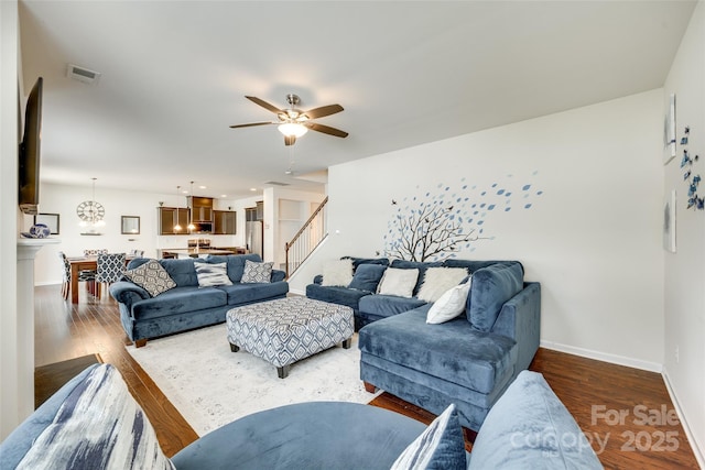 1553 Arcadia Bluff Dr, York, SC 29745 - living area featuring a ceiling fan, baseboards, wood finished floors, stairway, and a chandelier
