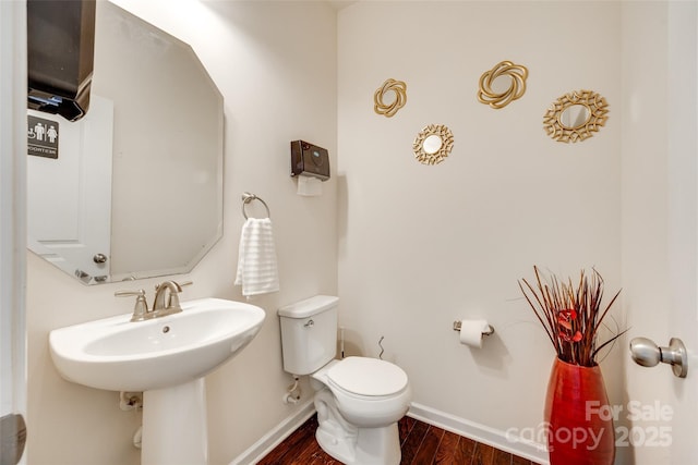 1553 Arcadia Bluff Dr, York, SC 29745 - half bathroom with baseboards, wood finished floors, toilet, and a sink