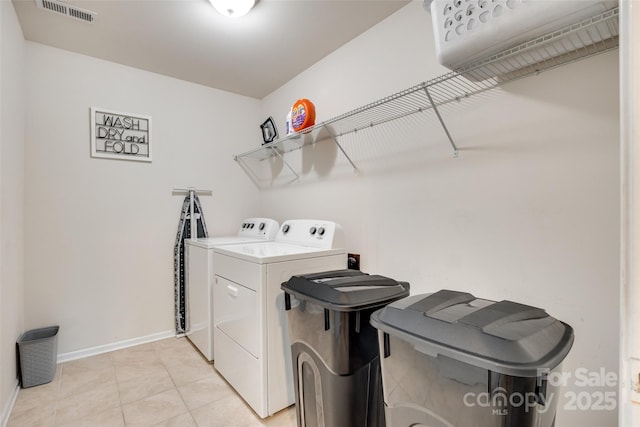 1553 Arcadia Bluff Dr, York, SC 29745 - laundry area with independent washer and dryer, baseboards, and light tile patterned flooring