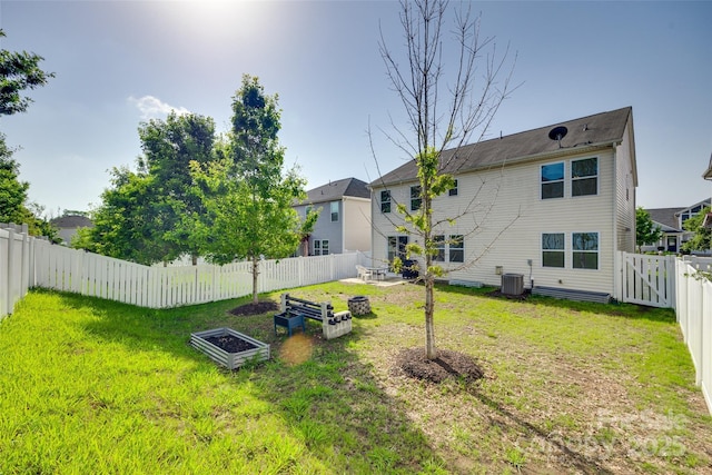 1553 Arcadia Bluff Dr, York, SC 29745 - back of property featuring central AC and a vegetable garden
