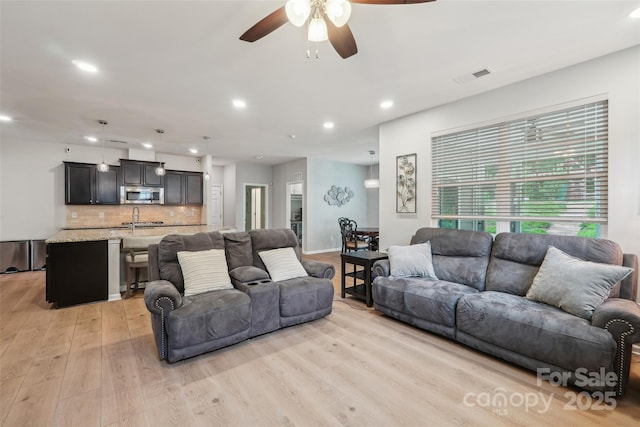 5812 Dinsmore Ln, Belmont, NC 28012 - living area featuring light wood-style floors, ceiling fan, and recessed lighting