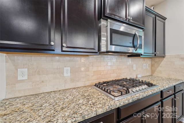 5812 Dinsmore Ln, Belmont, NC 28012 - kitchen with stainless steel appliances, light stone counters, and backsplash