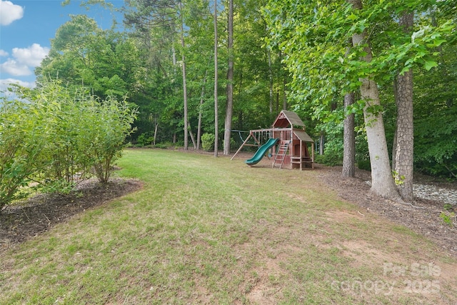 5812 Dinsmore Ln, Belmont, NC 28012 - view of green lawn featuring a playground