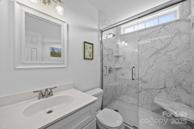 296 Planters Creek Rd, Fletcher, NC 28732 - bathroom featuring toilet, a marble finish shower, and vanity