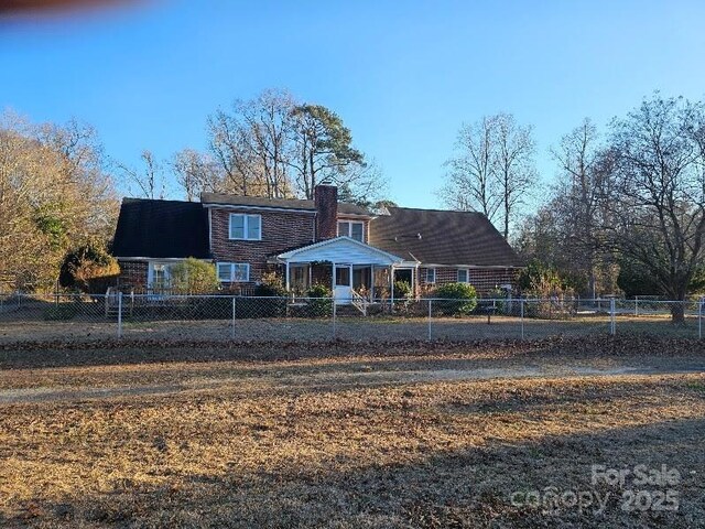 100 Boros Lndg, New Bern, NC 28560 - back of house featuring a chimney and fence