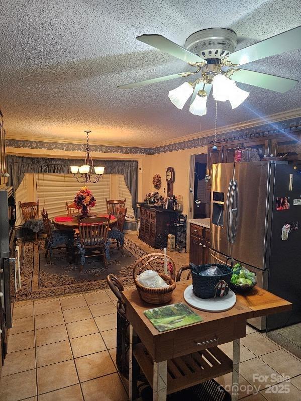 100 Boros Lndg, New Bern, NC 28560 - dining space with a ceiling fan, light tile patterned floors, a textured ceiling, and a chandelier
