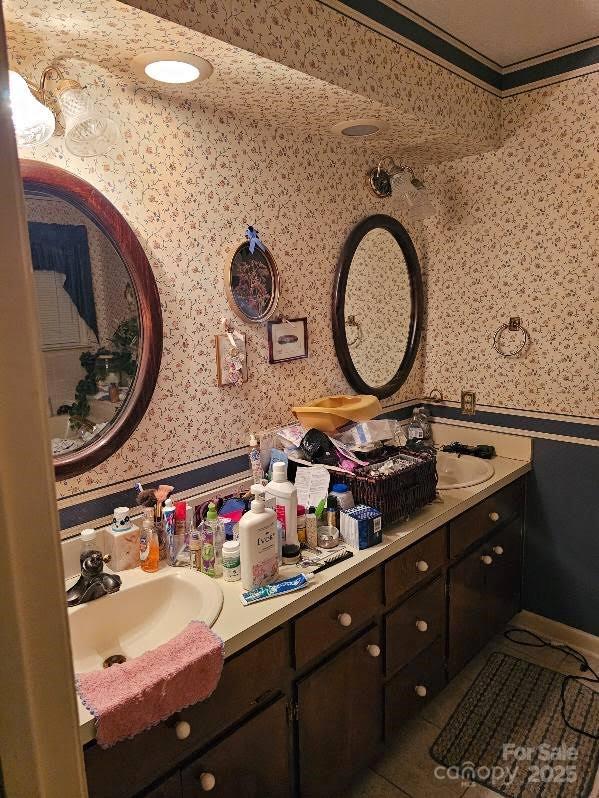 100 Boros Lndg, New Bern, NC 28560 - bathroom with wallpapered walls, vanity, and wainscoting