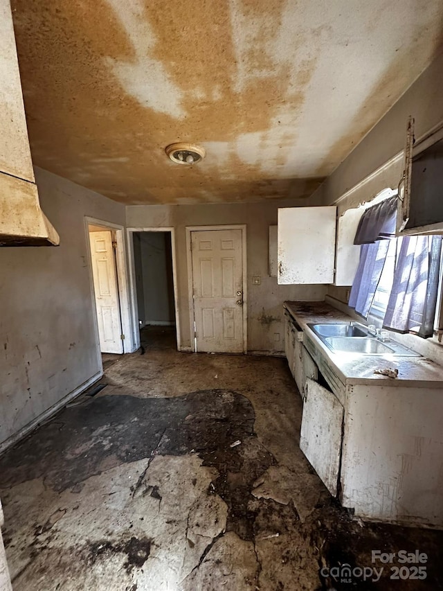 722 S Weldon St, Gastonia, NC 28052 - kitchen with a sink and white cabinets