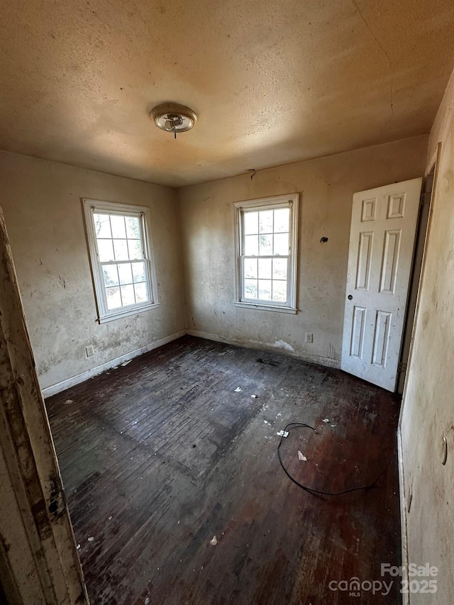 722 S Weldon St, Gastonia, NC 28052 - unfurnished room with hardwood / wood-style floors and a textured ceiling