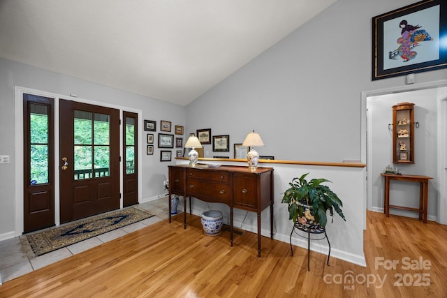 81 Corbin Shady Ln, Waynesville, NC 28785 - foyer featuring wood finished floors, baseboards, and high vaulted ceiling
