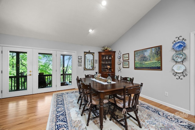 81 Corbin Shady Ln, Waynesville, NC 28785 - dining area with lofted ceiling, plenty of natural light, light wood finished floors, french doors, and recessed lighting