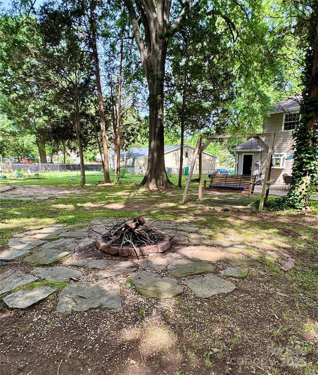 11718 Battery Pl, Charlotte, NC 28273 - view of yard featuring a fire pit and a patio