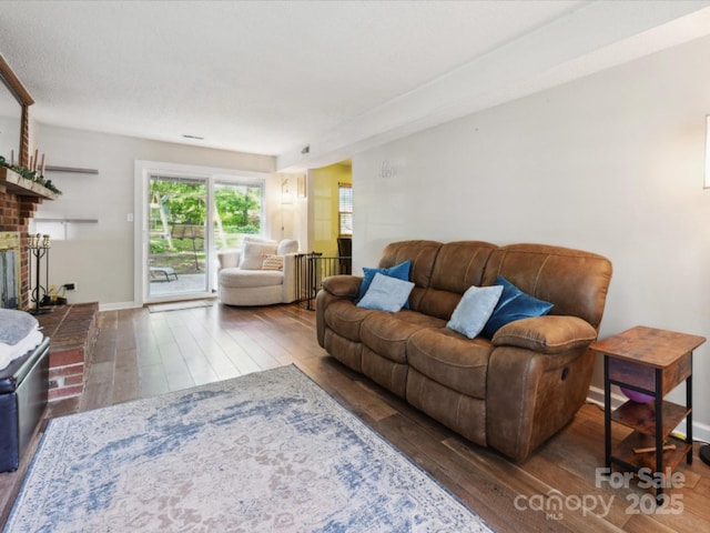 11718 Battery Pl, Charlotte, NC 28273 - living area featuring hardwood / wood-style flooring and a fireplace