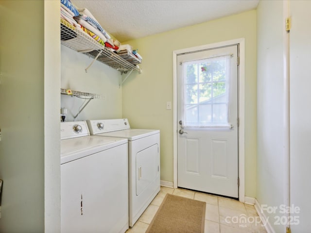 11718 Battery Pl, Charlotte, NC 28273 - laundry area with washing machine and clothes dryer, light tile patterned floors, and baseboards