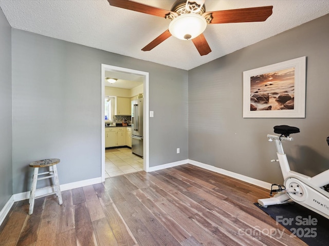 11718 Battery Pl, Charlotte, NC 28273 - exercise area with wood-type flooring, ceiling fan, and baseboards
