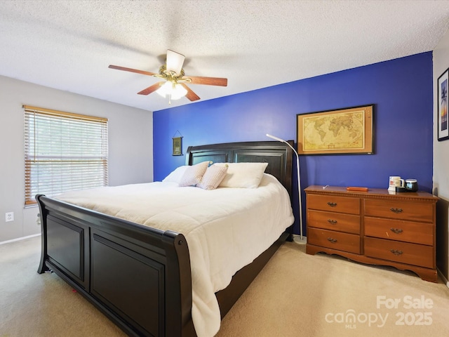 11718 Battery Pl, Charlotte, NC 28273 - bedroom featuring light carpet, baseboards, a ceiling fan, and a textured ceiling