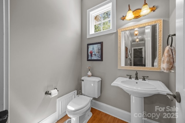 104 Golden Bell Ct, Mooresville, NC 28117 - half bathroom with baseboards, toilet, and wood finished floors