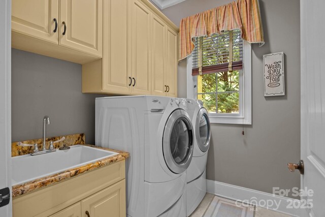 104 Golden Bell Ct, Mooresville, NC 28117 - clothes washing area with cabinet space, separate washer and dryer, and baseboards