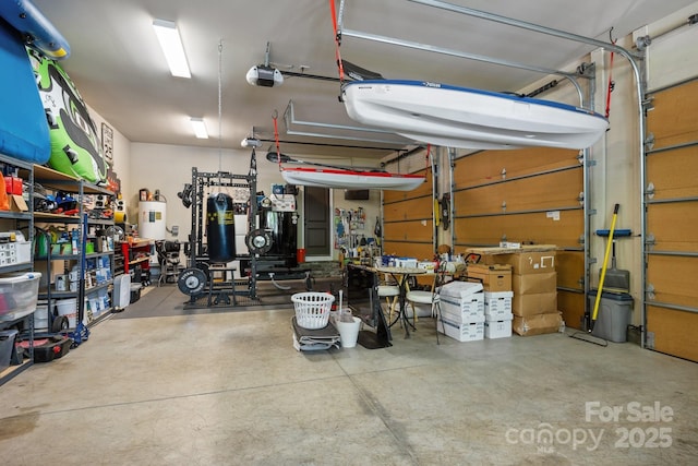 104 Golden Bell Ct, Mooresville, NC 28117 - garage featuring a garage door opener and a workshop area