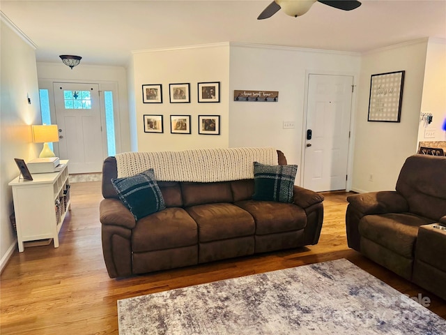 312 Shady Ln, Lincolnton, NC 28092 - living area featuring wood finished floors, ornamental molding, ceiling fan, and baseboards
