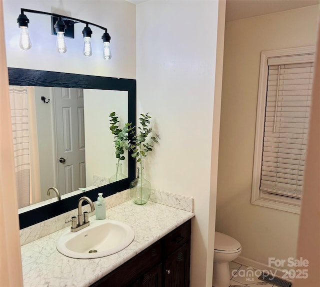 312 Shady Ln, Lincolnton, NC 28092 - bathroom featuring tile patterned floors, vanity, toilet, and baseboards