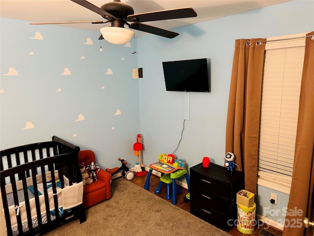 312 Shady Ln, Lincolnton, NC 28092 - bedroom with a nursery area, ceiling fan, and wood finished floors