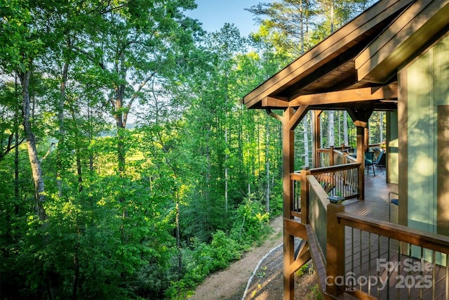 5688 Winding River Rd, Lenoir, NC 28645 - wooden deck featuring a view of trees