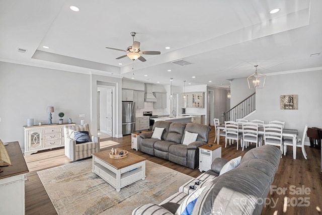 4532 Stellata Loop, Sherrills Ford, NC 28673 - living room with ceiling fan, wood finished floors, a chandelier, stairway, and recessed lighting