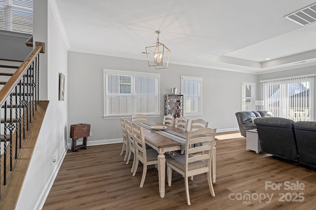 4532 Stellata Loop, Sherrills Ford, NC 28673 - dining room featuring wood finished floors, stairway, crown molding, baseboards, and a chandelier