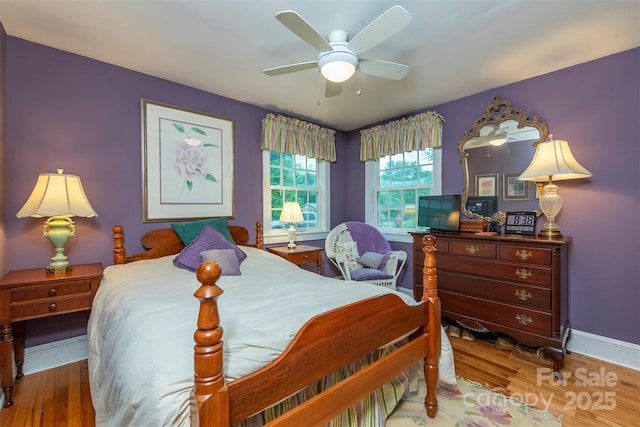 212 Vance Ave, Black Mountain, NC 28711 - bedroom featuring wood finished floors, baseboards, and ceiling fan