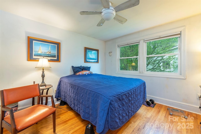 212 Vance Ave, Black Mountain, NC 28711 - bedroom with baseboards, light wood-style floors, and ceiling fan