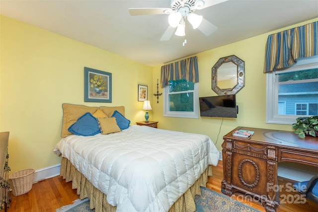 212 Vance Ave, Black Mountain, NC 28711 - bedroom with wood finished floors, baseboards, and ceiling fan
