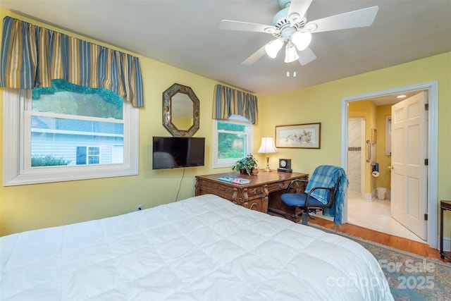 212 Vance Ave, Black Mountain, NC 28711 - bedroom with wood finished floors, ceiling fan, and ensuite bath