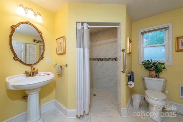 212 Vance Ave, Black Mountain, NC 28711 - full bath featuring toilet, a shower with shower curtain, baseboards, and marble finish flooring