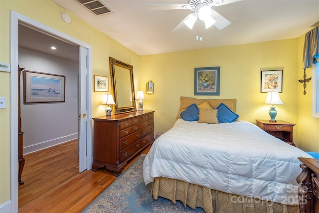 212 Vance Ave, Black Mountain, NC 28711 - bedroom with wood finished floors, baseboards, and a ceiling fan