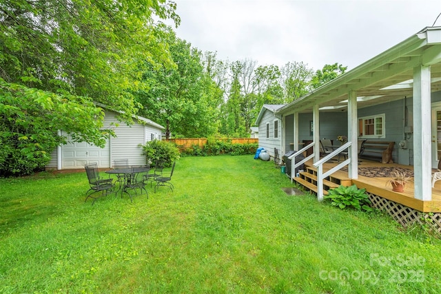212 Vance Ave, Black Mountain, NC 28711 - view of yard with a deck and an outbuilding