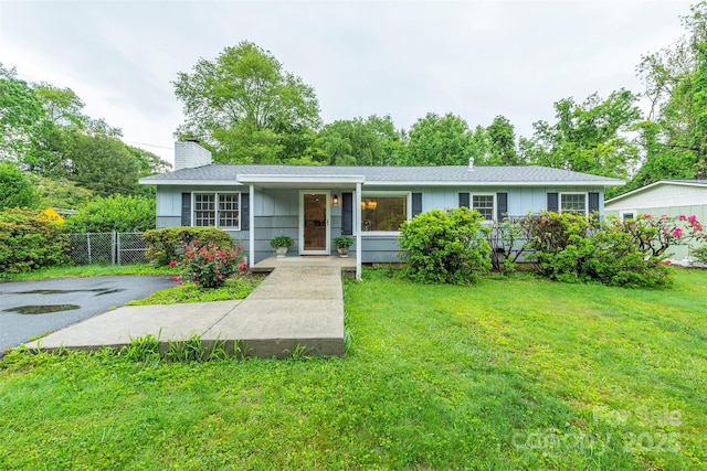 212 Vance Ave, Black Mountain, NC 28711 - view of front of house with a chimney and board and batten siding