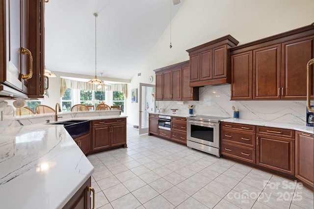 408 Emerald Bay Dr, Salisbury, NC 28146 - kitchen with stainless steel electric stove, tasteful backsplash, high vaulted ceiling, light tile patterned floors, and light stone counters