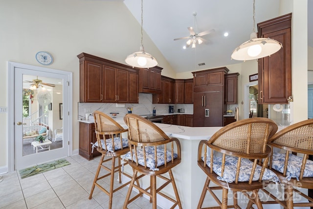 408 Emerald Bay Dr, Salisbury, NC 28146 - kitchen featuring a ceiling fan, high vaulted ceiling, paneled built in refrigerator, decorative backsplash, and light countertops
