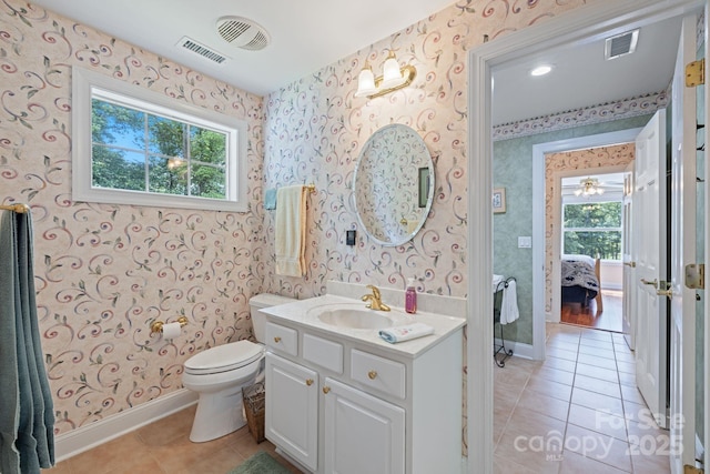 408 Emerald Bay Dr, Salisbury, NC 28146 - bathroom with tile patterned floors, ensuite bathroom, wallpapered walls, vanity, and baseboards
