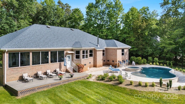 408 Emerald Bay Dr, Salisbury, NC 28146 - back of property featuring brick siding, a lawn, entry steps, a pool with connected hot tub, and a deck