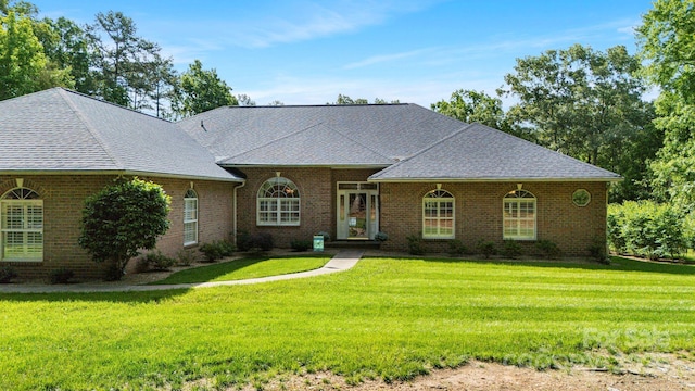 408 Emerald Bay Dr, Salisbury, NC 28146 - view of front of home featuring a front yard, a shingled roof, and brick siding