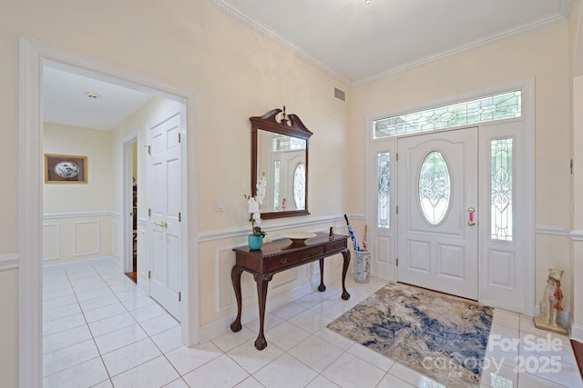 408 Emerald Bay Dr, Salisbury, NC 28146 - entryway with healthy amount of natural light, a decorative wall, light tile patterned floors, ornamental molding, and wainscoting