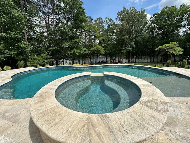 408 Emerald Bay Dr, Salisbury, NC 28146 - view of swimming pool featuring a pool with connected hot tub and view of scattered trees