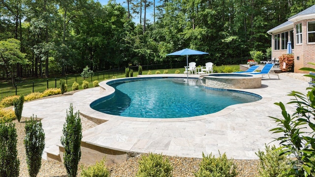 408 Emerald Bay Dr, Salisbury, NC 28146 - view of pool with a patio, a pool with connected hot tub, and view of scattered trees