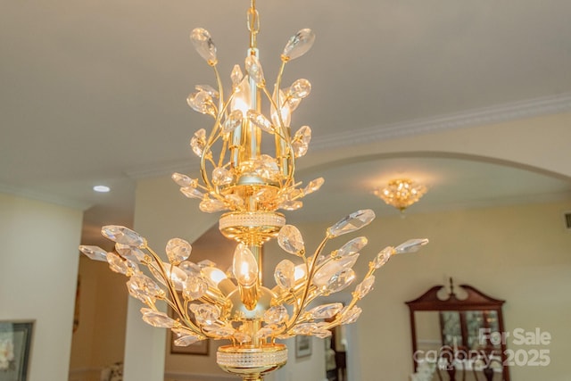 408 Emerald Bay Dr, Salisbury, NC 28146 - detailed view of a chandelier, arched walkways, ornamental molding, and recessed lighting