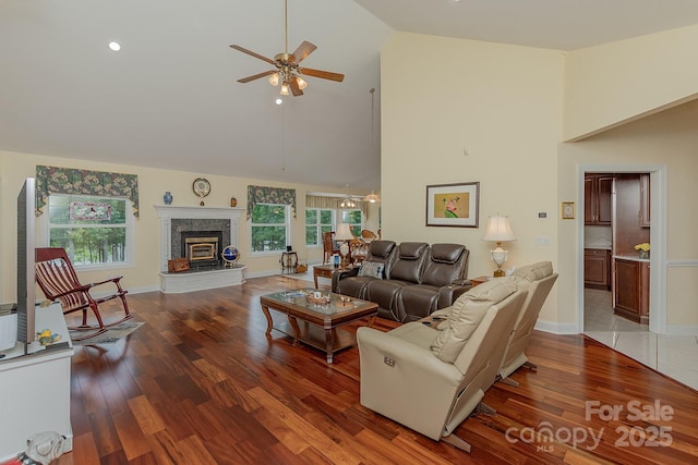 408 Emerald Bay Dr, Salisbury, NC 28146 - living area with a ceiling fan, high vaulted ceiling, wood finished floors, and a glass covered fireplace