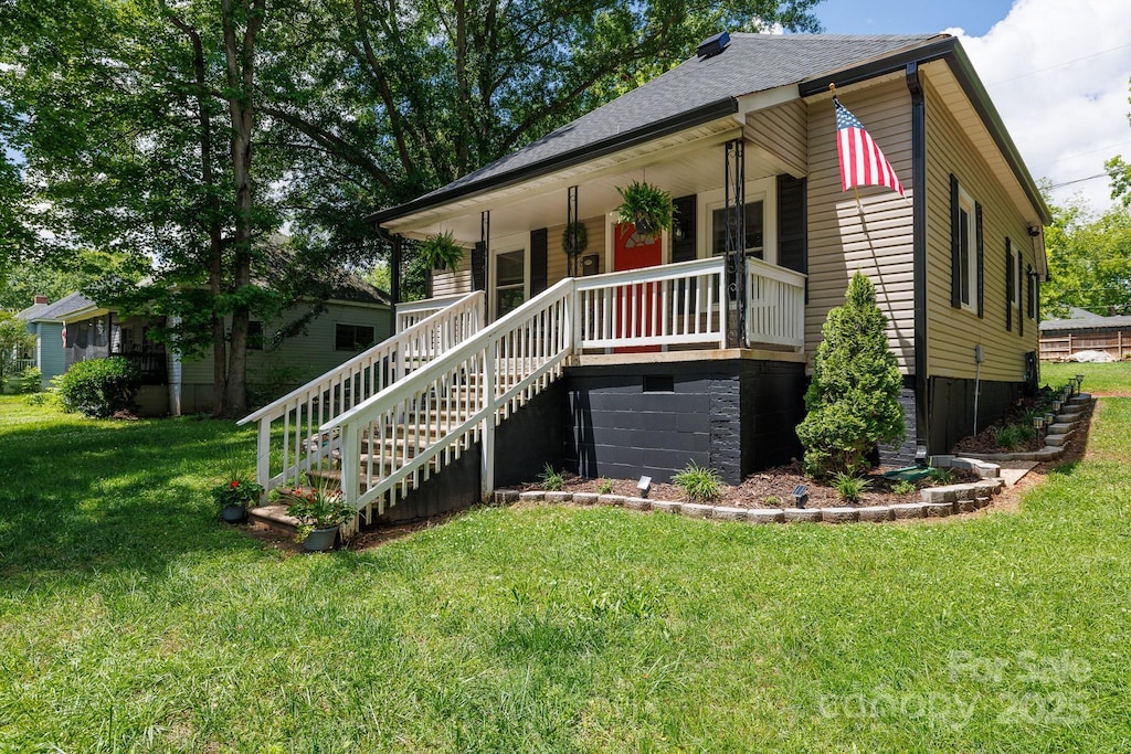118 Sunset Dr, Clover, SC 29710 - view of front of house featuring stairway, a porch, a front lawn, and a shingled roof